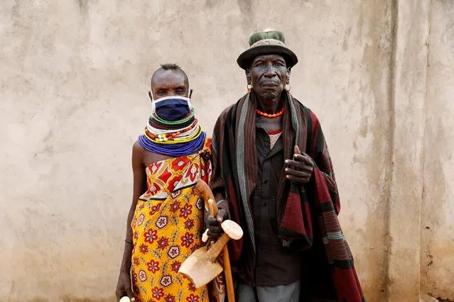 Wear Esinyen, 72, and his wife Namosi Esinyen, 50, from the Turkana tribe pose for a picture in the village of Lorengippi near the town of Lodwar, Turkana county, Kenya on July 3, 2020. (Photo by Baz Ratner/Reuters)