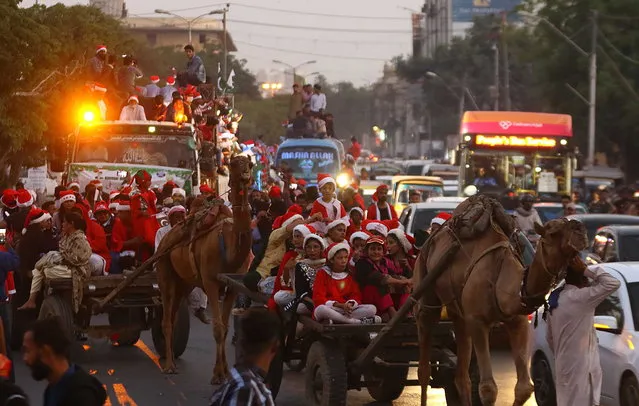 Members of the Pakistani Christian minority parade on a road ahead of Christmas, in Karachi, Pakistan, 11 December 2022. (Photo by Shahzaib Akber/EPA/EFE)