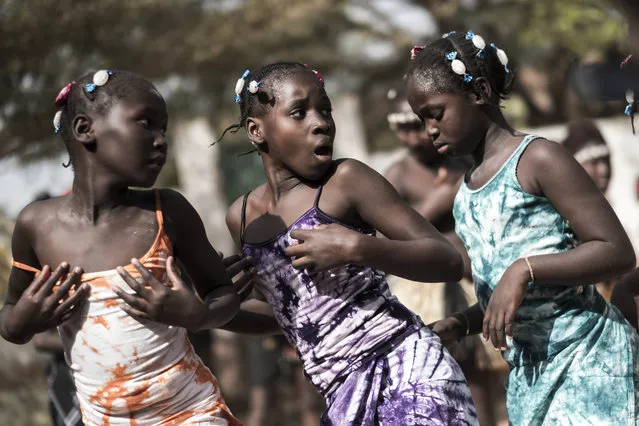 Girls rehearse a performance in a school ahead of the Bissau Carnival parade on February 10, 2018 in Bissau. The 2018 edition of the Bissau Carnival celebrating diversity and nature is held from February 10 to 13, 2018. (Photo by Xaume Olleros/AFP Photo)