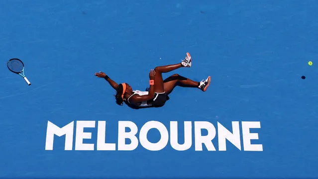 Coco Gauff of the U.S. falls during her fourth round match against Latvia's Jelena Ostapenko during the Asutralia Open tennis championship in Melbourne, Australia on January 22, 2023. (Photo by Carl Recine/Reuters)