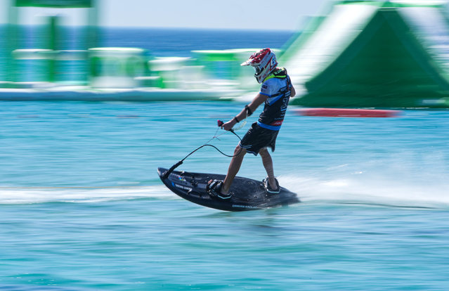 Competitors are seen racing in the turquoise waters of Altinkum Beach during the World Motosurf Championship in Cesme district of Izmir, Turkiye, on June 20, 2025. Athletes from 16 countries are participating in the international event, which is being held in Turkiye for the first time. Riders began their training and qualifying rounds ahead of the main races. (Photo by Berkan Cetin /Anadolu via Getty Images)