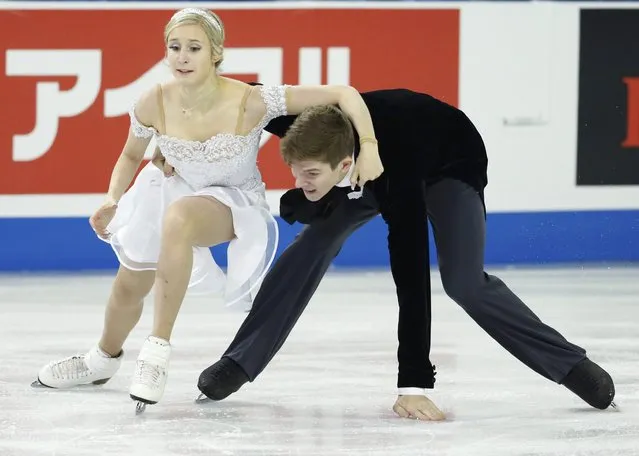 Anna Yanovskaya and Sergey Mozgov of Russia lose their balance as they perform during the ice dance short program at the Skate America figure skating competition in Milwaukee, Wisconsin October 23, 2015. (Photo by Lucy Nicholson/Reuters)