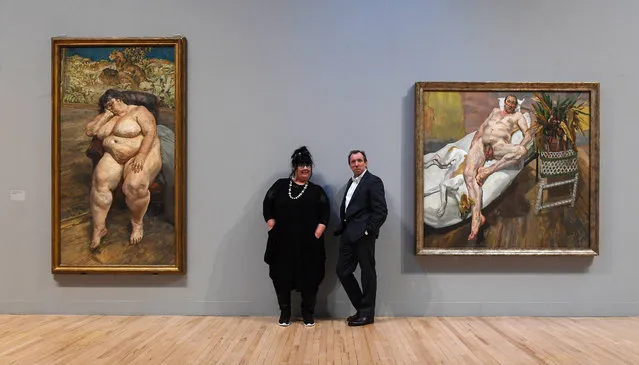 Sue Tilley whom Lucian Freud painted in “Sleeping by the Lion Carpet” (L) with Lucian Freud's assistant, David Dawson (R) whom Freud painted in 2003-4 in David & Eli (R) pose in front of Freud's paintings during the “All Too Human” exhibit at the Tate Britain in London, Britain, 26 February 2018. All Too Human celebrates the painters in Britain who strove to represent human figures, their relationships and surroundings in the most intimate of ways. (Photo by Andy Rain/EPA/EFE)