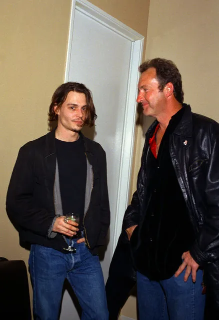 Actors Johnny Depp, left, and Randy Quaid share a moment during a benefit preview party for Depp's new short film, “Banter”, created to benefit Drug Abuse Resistance Education efforts, at Smashbox Studios, February 22, 1994, near Los Angeles. (Photo by Reed Saxon/AP Photo)