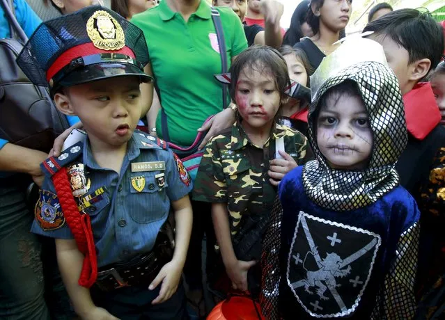 Students of Brainshire School dawn scary and colorful costumes as they participate in a halloween parade in Paranaque city, metro Manila October 30, 2015. (Photo by Romeo Ranoco/Reuters)