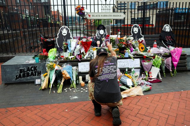 A fan pays tribute following the death of Ozzy Osbourne at the Black Sabbath Bridge, on Broad Street in Birmingham, Britain, on July 23, 2025. (Photo by Isabel Infantes/Reuters)