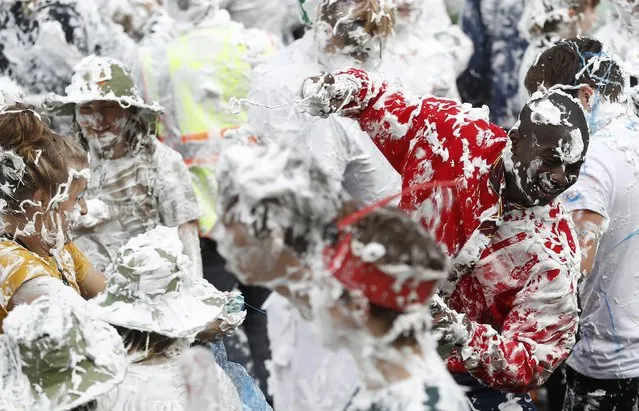 Students from St Andrews University are covered in foam as they take part in the traditional “Raisin Weekend” in the Lower College Lawn, at St Andrews in Scotland, Britain October 17, 2016. (Photo by Russell Cheyne/Reuters)