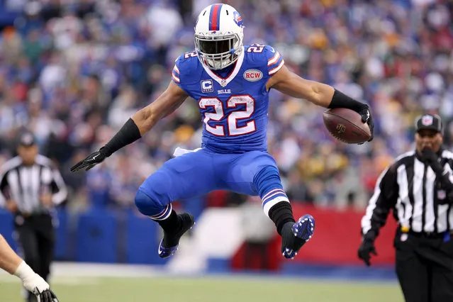 December 14, 2014; Orchard Park, NY, USA; Buffalo Bills running back Fred Jackson (22) jumps to avoid a tackle during the second half against the Green Bay Packers at Ralph Wilson Stadium. (Photo by Timothy T. Ludwig/USA TODAY Sports)