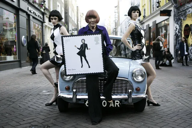 British fashion designer Mary Quant, center, poses in London on January 9, 2009. Quant, the designer whose fashions epitomized the Swinging 60s, has died at the age of 93. Quant's family said she died “peacefully at home” in Surrey, southern England, on Thursday, April 13, 2023. (Photo by David Parry/PA Wire via AP Photo)