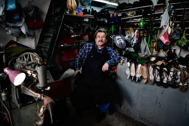 Simeon Simeonidis, a traditional shoemaker poses in his business in central Athens on April 18, 2018. (Photo by Louisa Gouliamaki/AFP Photo)