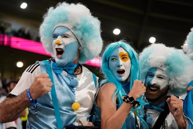 Fans of Argentina cheer before the World Cup round of 16 soccer match between Argentina and Australia at the Ahmad Bin Ali Stadium in Doha, Qatar, Saturday, December 3, 2022. (Photo by Lee Jin-man/AP Photo)