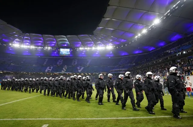 Police leave the pitch after the Bundesliga playoffs second leg match between Hamburger SV and VfB Stuttgart at Volksparkstadion on June 05, 2023 in Hamburg, Germany. (Photo by Maja Hitij/Getty Images)