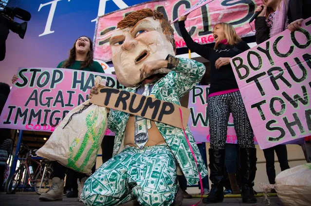 Donald Trump impersonator Tighe Barry leads pro-refugee activists in front of the Trump International hotel on Pennsylvania Avenue in Washington, US on December 11, 2015. (Photo by Jeff Malet/SIPA/Rex Shutterstock)