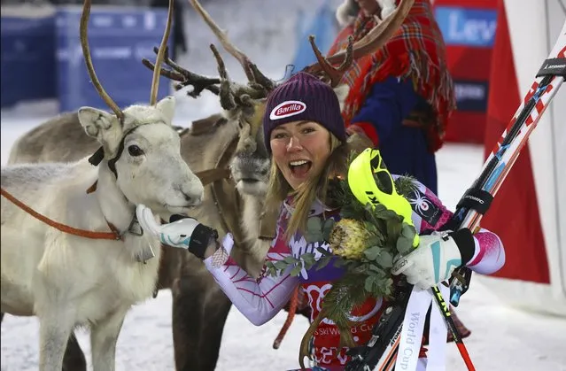 First placed Mikaela Shiffrin caresses a reindeer after winning an alpine skiing women's World Cup slalom, in Levi, Finland, Saturday November 12, 2016. (Photo by Alessandro Trovati/AP Photo)