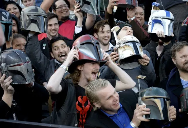 Fans hold up helmets at the premiere of "Star Wars: The Force Awakens" in Hollywood, California, December 14, 2015. (Photo by Kevork Djansezian/Reuters)