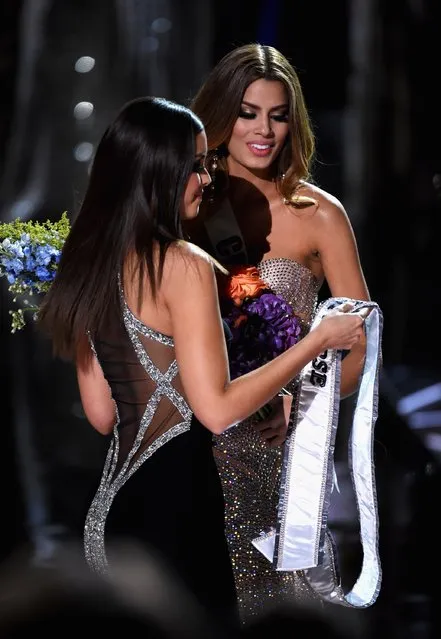 Miss Colombia 2015, Ariadna Gutierrez (R), is incorrectly named as winner of Miss Universe 2015 and returns her winner's Sash to Miss Universe 2014, Paulina Vega,  during the 2015 Miss Universe Pageant at The Axis at Planet Hollywood Resort & Casino on December 20, 2015 in Las Vegas, Nevada. (Photo by Ethan Miller/Getty Images)