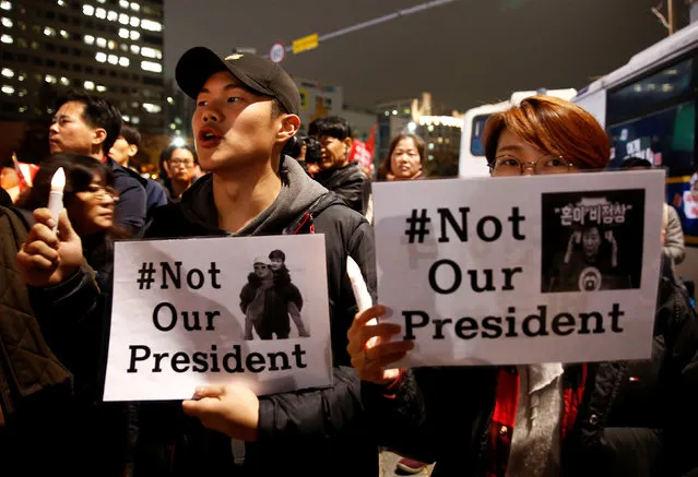 Protesters shout slogans after they are blocked by riot policemen in a road nearby the presidential Blue House during their march calling South Korean President Park Geun-hye to step down in Seoul, South Korea, November 19, 2016. (Photo by Kim Hong-Ji/Reuters)
