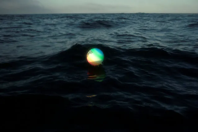 A plastic ball for beach volleyball games is seen floating in the Strait of Gibraltar, about 6.8 miles (11 km) of distance from the nearest coast, near Barbate, southern Spain, July 31, 2018. (Photo by Jon Nazca/Reuters)