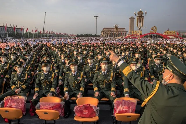Members of the Chinese military wait in Tiananmen Square before a parade marking the 100th founding anniversary of the Chinese Communist Party, in Beijing, China, 01 July 2021. China celebrates on 01 July the 100th anniversary of the founding of the ruling Communist Party of China (CCP). (Photo by Roman Pilipey/EPA/EFE)