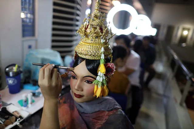 Dancers get ready backstage before a performance of masked theatre known as Khon which was recently listed by UNESCO, the United Nations' cultural agency, as an intangible cultural heritage, along with neighbouring Cambodia's version of the dance, known as Lakhon Khol at the Thailand Cultural Centre in Bangkok, Thailand on November 7, 2018. (Photo by Jorge Silva/Reuters)