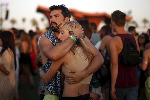 A couple listens to Hozier at the Coachella Valley Music and Arts Festival in Indio, California April 11, 2015. (Photo by Lucy Nicholson/Reuters)