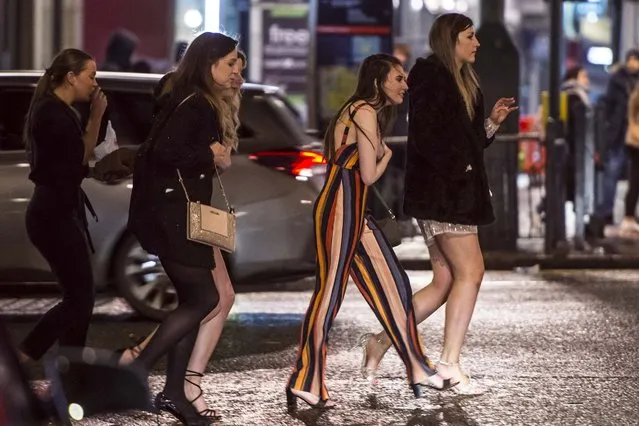 A group of girls cross a road in Leeds city centre last night (FRI) as the country heads back on the booze after completing “Dry January”, a challenge to not drink throughout the month of January on February 2, 2019. (Photo by South West News Service)