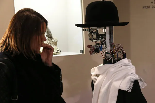The Berenson robot analyzes a visitor during the exhibition “Persona : Oddly Human” at the Quai Branly museum in Paris, France, February 23, 2016. (Photo by Philippe Wojazer/Reuters)