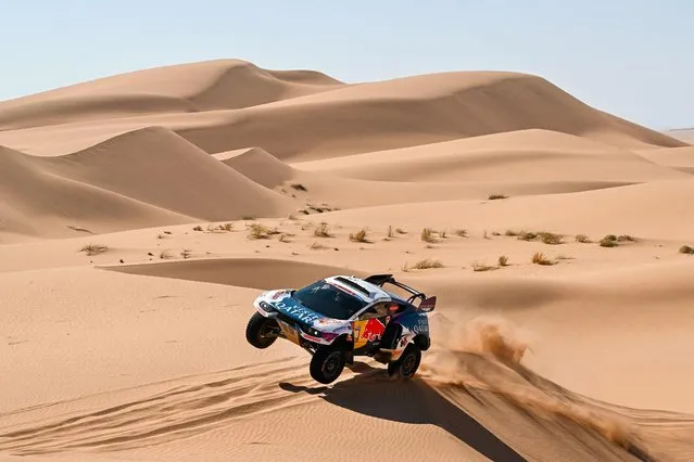 Nasser Racing's Qatari driver Nasser Al-Attiyah and his French co-driver Mathieu Baumel compete during Stage 3 of the Dakar Rally 2024, between Al Duwadimi and Al Salamiya, Saudi Arabia, on January 8, 2024. (Photo by Patrick Hertzog/AFP Photo)