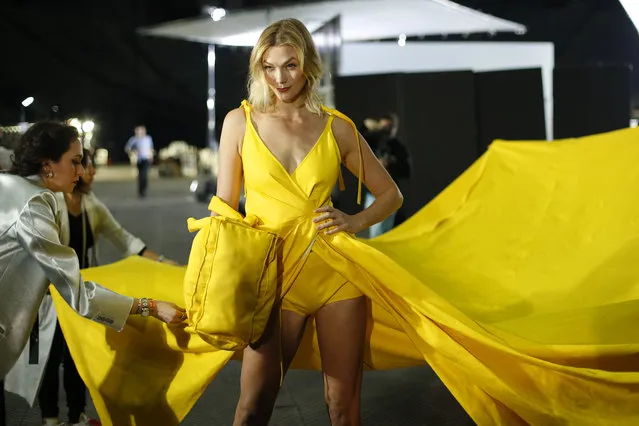 Model Karlie Kloss has her dress adjusted backstage prior to the Off-White ready to wear Fall-Winter 2019-2020 collection, that was presented in Paris, Thursday, February 28, 2019. (Photo by Thibault Camus/AP Photo)