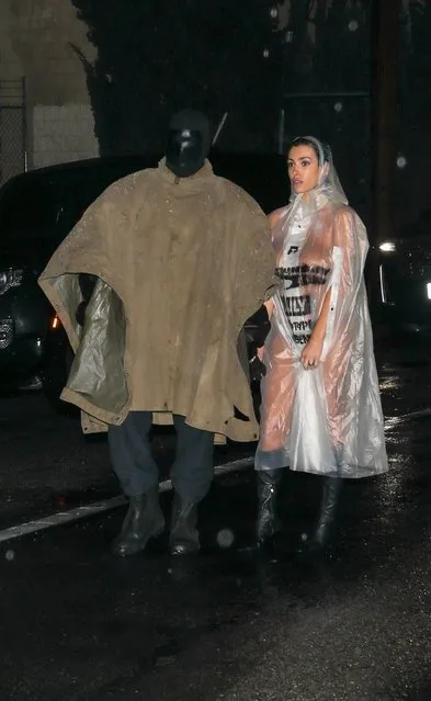 The Australian designer Bianca Censori stripped naked under a see-through poncho during an outing with American rapper Kanye West in LA early February 2024. She accessorized with a pair of black leather boots. (Photo by Backgrid USA)
