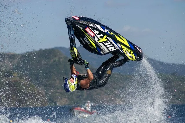 Mark Gomez, of the United States, does freestyle jumps on his jet ski during the “Lake Ilopango Water Jet Sport GP 2024”, in San Salvador, El Salvador, on January 28, 2024. The “Lake Ilopango Water Jet Sport GP 2024” is organized to raise awareness about the care of the waters of lakes, rivers and seas. The Competidos did acrobatics on Lake Ilopango, which is of volcanic origin, its crater is located right at the bottom of the lake, it is the largest lake in El Salvador with a surface area of 72 square kilometers and a depth of 250 meters. (Photo by Alex Pena/Anadolu via Getty Images)