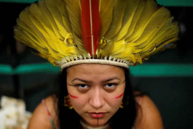 A Brazilian Indian attends a meeting with congressmen during the Terra Livre camp, or Free Land camp, at the National Congress in Brasilia, Brazil, April 25, 2019. (Photo by Adriano Machado/Reuters)