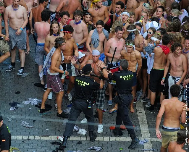 Civil Guards try to calm revellers during the Tomatina festival