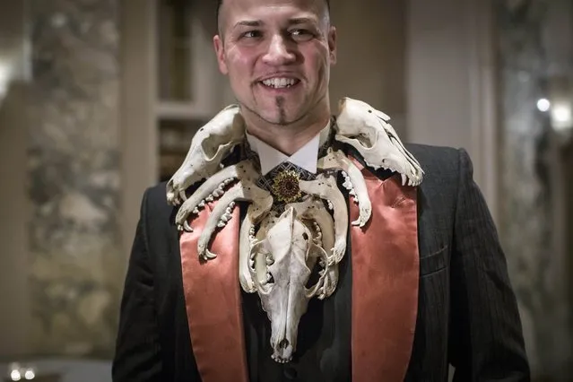 Club member and food critic known as Baron Ambrosia wears coyote skulls during the 110th Explorers Club Annual Dinner at the Waldorf Astoria in New York March 15, 2014. (Photo by Andrew Kelly/Reuters)