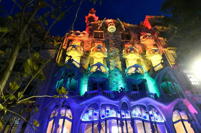 Spanish Catalan architect Antoni Gaudi's Casa Batllo is lit with the rainbow flag for Gay Pride month in Barcelona on June 28, 2019. (Photo by Josep Lago/AFP Photo)