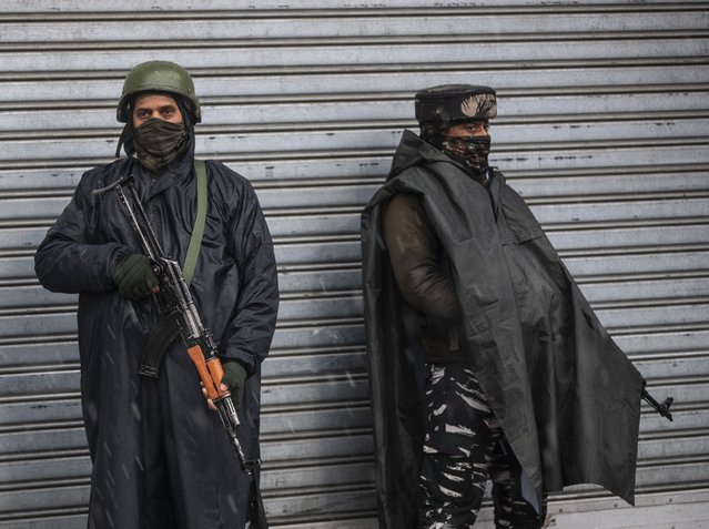 Indian paramilitary soldiers stand guard in Srinagar, Indian controlled Kashmir, Saturday, January 8, 2022. The New York-based Committee to Protect Journalists asked Indian authorities to immediately release journalist Sajad Gul in disputed Kashmir, days after police arrested him for uploading a video clip of a protest against Indian rule. Indian soldiers picked up Gul from his home in northeastern Shahgund village on Wednesday night and later handed him over to the police, his family said. He had posted a video of family members and relatives protesting the killing of a rebel commander on Monday. (Photo by Mukhtar Khan/AP Photo)