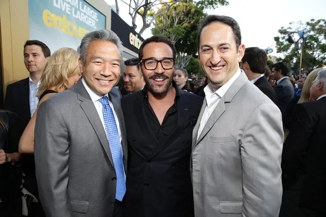 Kevin Tsujihara, Chief Executive Officer of Warner Bros., Jeremy Piven and Greg Silverman, President of Creative Development and Worldwide Production at Warner Bros. Pictures seen at Warner Bros. Premiere of "Entourage" held at Regency Village Theatre on Monday, June 1, 2015, in Westwood, Calif. (Photo by Eric Charbonneau/Invision for Warner Bros./AP Images)