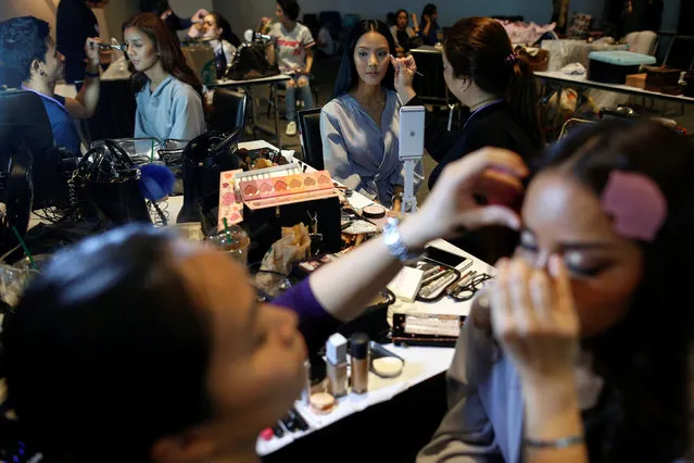 Beauty contestants prepare backstage before the fashion show of Miss Tiffany's Universe 2016 transvestite contest in Bangkok, Thailand, April 20, 2016. (Photo by Athit Perawongmetha/Reuters)
