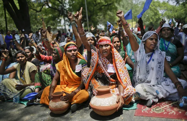 Villagers from various Indian states shout slogans during a protest demonstration to highlight the water shortage across the country in New Delhi, India, Thursday, May 5, 2016. Much of India is reeling under heat wave and severe drought conditions that have decimated crops, killed livestock and left at least 330 million Indians without enough water for their daily needs. (Photo by Altaf Qadri/AP Photo)