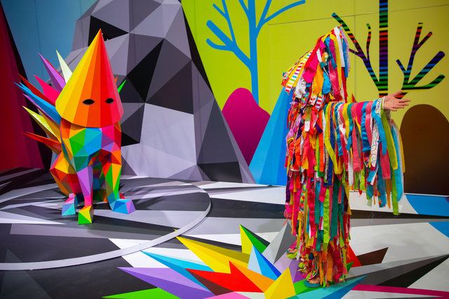 A dancer performs during a media tour of the immersive experience “Metamorfosis” by Okuda San Miguel, at the Fronton Mexico facilities, in Mexico City, Mexico on February 01, 2023. The work of Spanish visual artist Oscar San Miguel Erice, better known as Okuda San Miguel is characterized by multicolored geometric structures and patterns categorized as Pop Surrealism, his work has been exhibited in countries such as Germany, France and the United States. (Photo by Daniel Cardenas/Anadolu Agency via Getty Images)