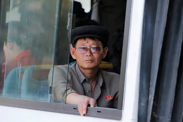 A man looks from inside a trolleybus in central Pyongyang, North Korea May 8, 2016. (Photo by Damir Sagolj/Reuters)