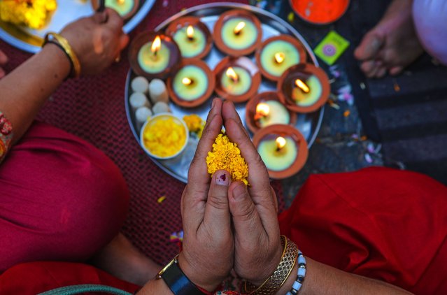 Kashmiri Hindu devotees pray during a religious festival at the Kheer Bhawani temple at Tullamulla Village, Ganderbal, Kashmir, India, 14 June 2024. Thousands of devotees attended the prayers in the temple that is dedicated to the Hindu goddess Kheer Bhawani. (Photo by Farooq Khan/EPA/EFE)