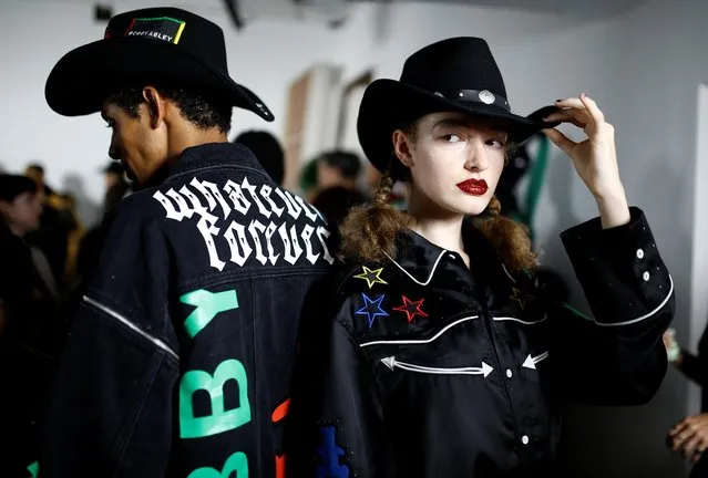 Models prepare backstage ahead of the Bobby Abley catwalk show at London Fashion Week in London, Britain, September 17, 2019. (Photo by Henry Nicholls/Reuters)