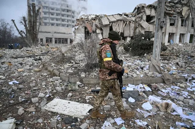 A Ukrainian service member walks near a school building destroyed by shelling, as Russia's invasion of Ukraine continues, in Zhytomyr, Ukraine March 4, 2022. (Photo by Viacheslav Ratynskyi/Reuters)