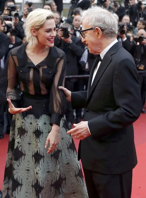 Director Woody Allen jokes with cast member Kristen Stewart on the red carpet as they arrive for the opening ceremony and the screening of the film “Cafe Society” out of competition during the 69th Cannes Film Festival in Cannes, France, May 11, 2016. (Photo by Regis Duvignau/Reuters)