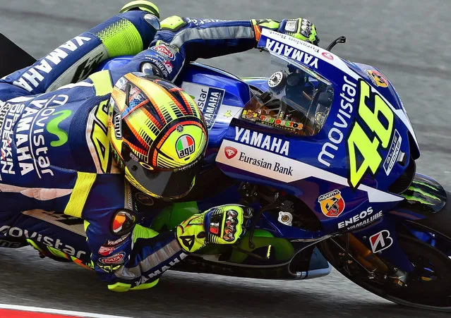 Italian MotoGP rider Valentino Rossi of the Movistar Yamaha MotoGP team in action during the first free practice session at the Sachsenring circuit in Hohenstein-Ernstthal, Germany, 10 July 2015. The Motorcycling Grand Prix of Germany will take place on 12 July 2015. (Photo by Hendrik Schmidt/EPA)