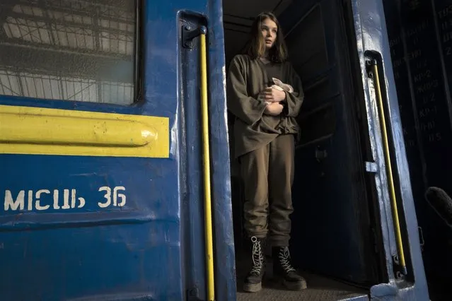 Julia, 16, from Dnipro, who is traveling alone, holds her pet rabbit Baby after arriving to the Lviv main station, western Ukraine, Thursday, March 24, 2022. She was on her way to join her mother and then go on to Poland or Germany. (Photo by Nariman El-Mofty/AP Photo)