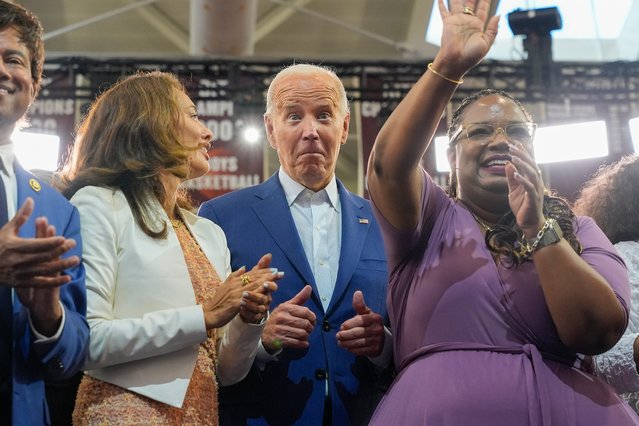 President Joe Biden on stage with supporters after speaking at Renaissance High School, Friday, July 12, 2024, during a campaign event in Detroit. (Photo by Jacquelyn Martin/AP Photo)