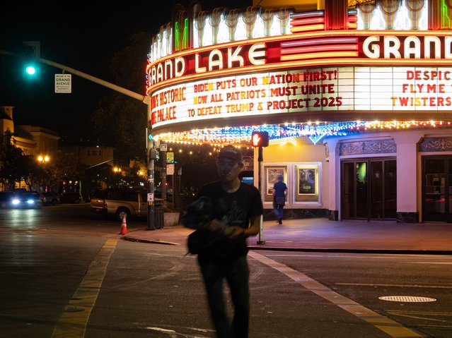 The historic Grand Lake Theater, known for making political statments on its iconic marquee, displays a statement of President Biden’s annoucment of stepping down, which reads: “Biden Puts our Nation First! Now All Patriots must Unite to Defeat Trump & Project 2025”, in Oakland, California, USA, 21 July 2024. President Biden has endorsed Vice-President Kamala Harris to run in his place. Harris was born in Oakland and raised in nearby Berkeley, California. (Photo by John G Mabanglo/EPA/EFE)