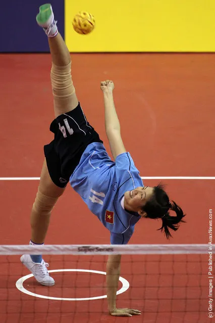 Sepaktakraw: Nguyen Thi Bich Thuy of Vietnam serves to Japan during day one of the ISTAF Super Series